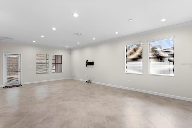 unfurnished room with baseboards, recessed lighting, visible vents, and crown molding