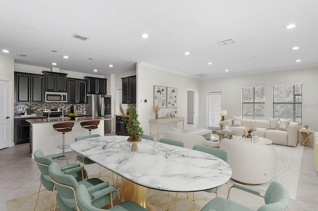 dining area featuring recessed lighting, visible vents, crown molding, and light tile patterned floors