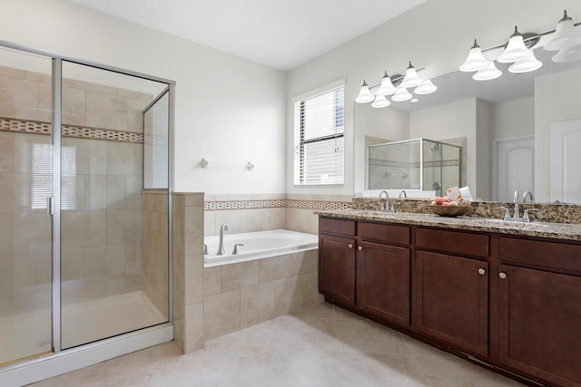 bathroom featuring a garden tub, double vanity, a stall shower, a sink, and tile patterned flooring