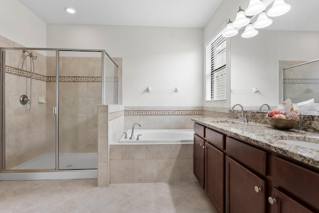 full bath with a garden tub, a sink, and a shower stall