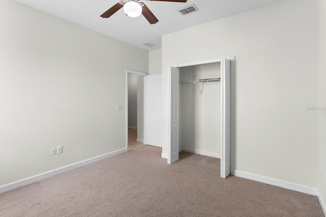 unfurnished bedroom featuring a closet, visible vents, carpet flooring, ceiling fan, and baseboards