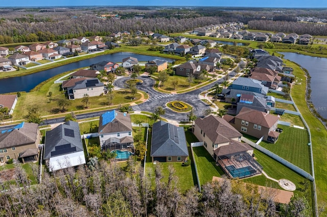 birds eye view of property featuring a residential view and a water view