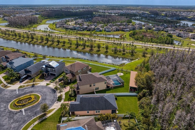 bird's eye view with a residential view and a water view