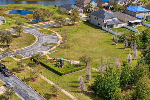 bird's eye view with a water view and a residential view