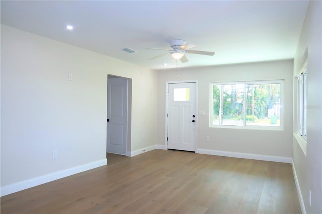 foyer featuring visible vents, baseboards, ceiling fan, wood finished floors, and recessed lighting