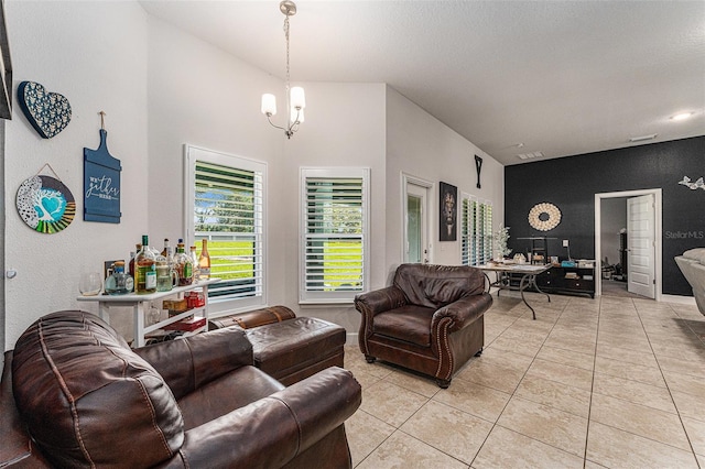 living room featuring visible vents, a chandelier, and light tile patterned flooring