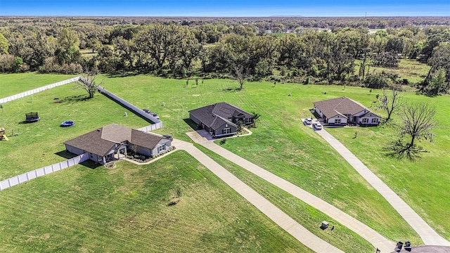 birds eye view of property with a wooded view and a rural view