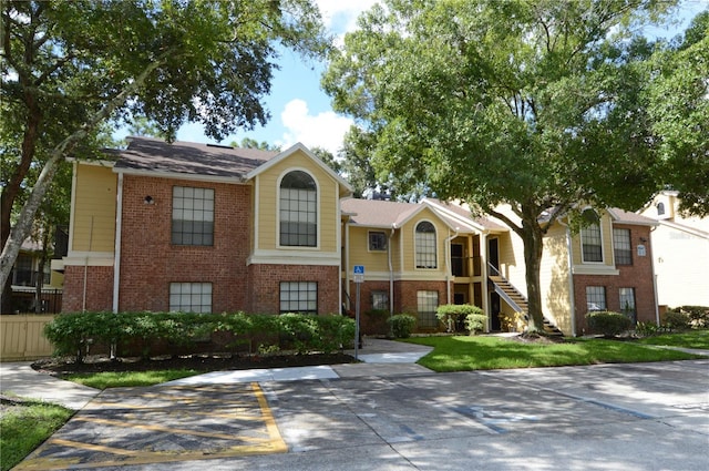 view of front of property with brick siding