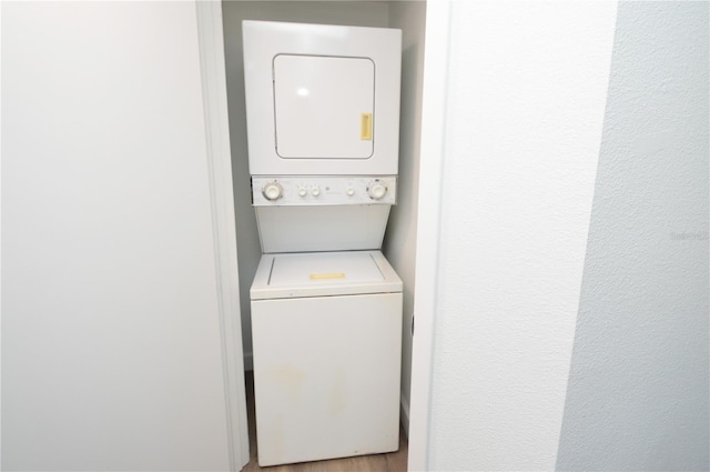 laundry area featuring laundry area and stacked washing maching and dryer