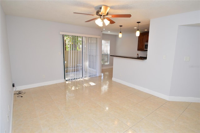 unfurnished room with baseboards, recessed lighting, light tile patterned flooring, a textured ceiling, and a ceiling fan