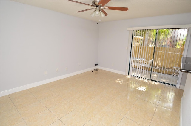 empty room with light tile patterned floors, baseboards, and a ceiling fan