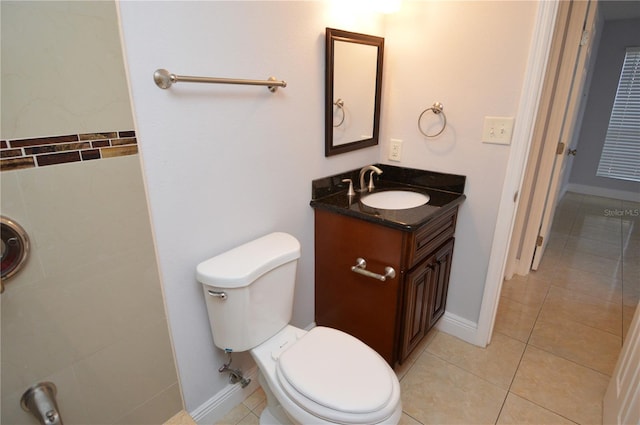 bathroom with tile patterned floors, toilet, and vanity