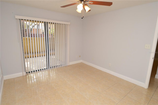 unfurnished room featuring baseboards, light tile patterned flooring, and a ceiling fan