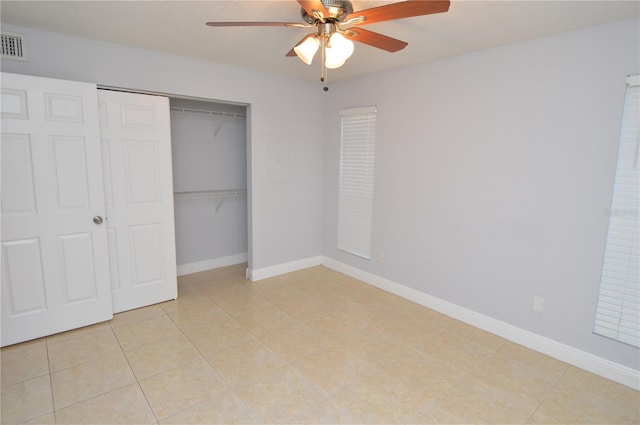 unfurnished bedroom featuring a closet, visible vents, ceiling fan, and baseboards