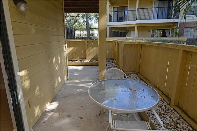 view of patio featuring fence