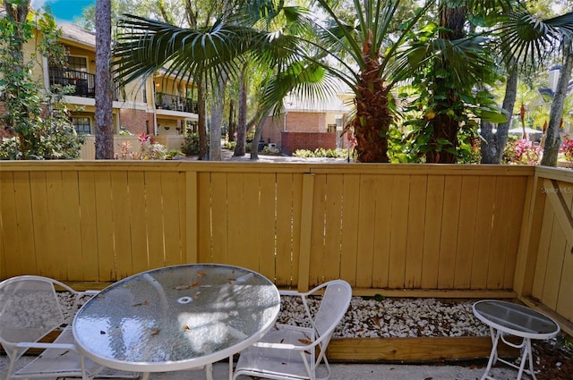 view of patio featuring fence