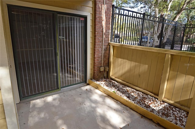 view of patio / terrace featuring fence