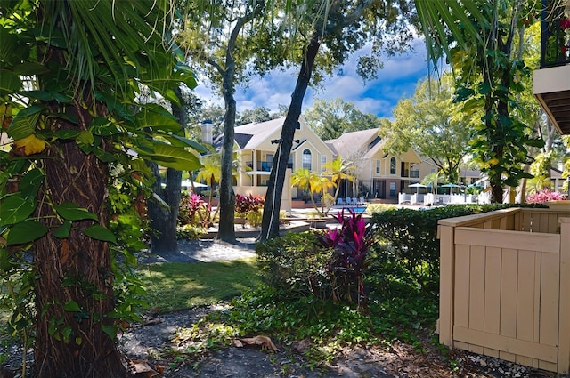 view of yard with fence and a residential view