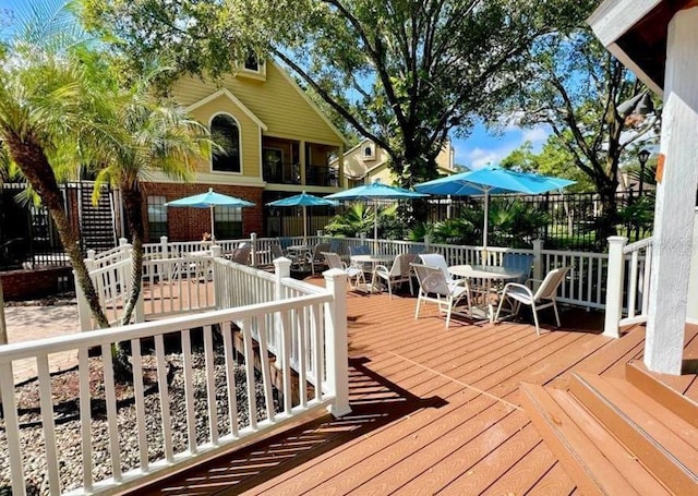 deck with outdoor dining area