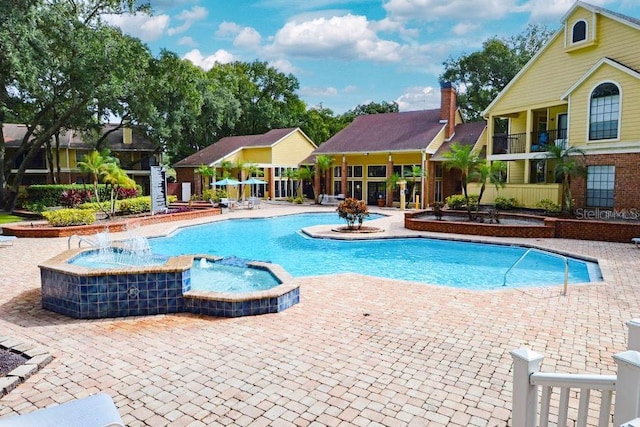 view of swimming pool featuring a patio area