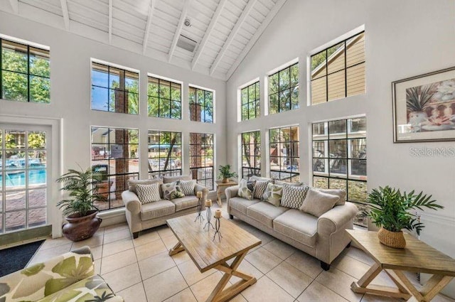 sunroom / solarium featuring wood ceiling and vaulted ceiling with beams