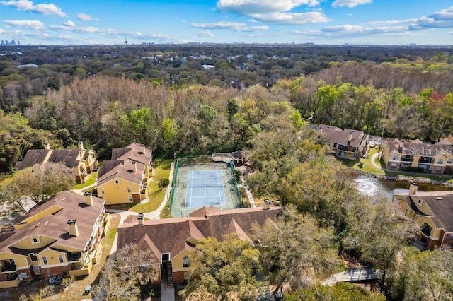 aerial view with a wooded view and a residential view