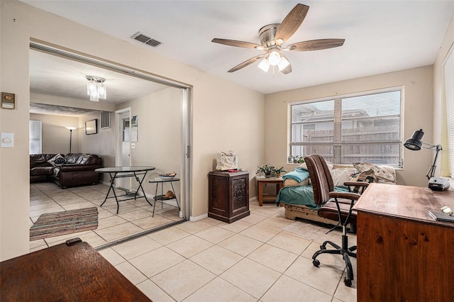 office area featuring light tile patterned floors, baseboards, visible vents, and a ceiling fan