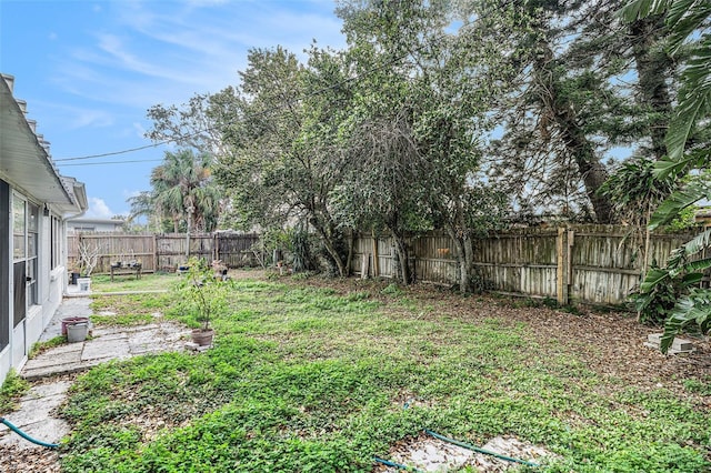 view of yard with a fenced backyard