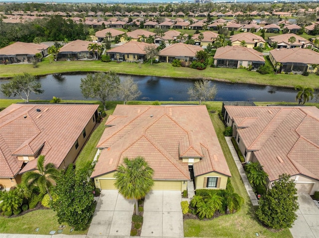 aerial view with a residential view and a water view