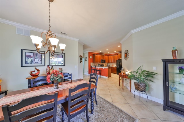 dining space with visible vents, crown molding, and light tile patterned floors