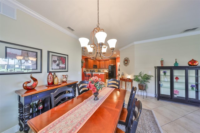 dining space with visible vents, ornamental molding, and light tile patterned flooring