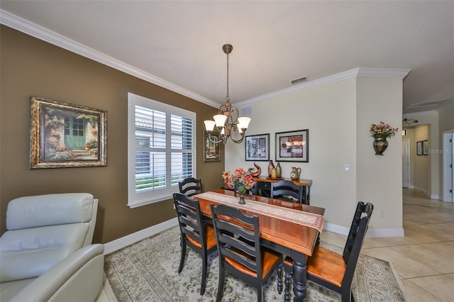 dining space featuring a notable chandelier, baseboards, crown molding, and light tile patterned flooring