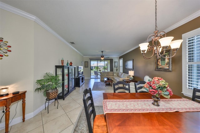 dining room with light tile patterned floors, visible vents, ornamental molding, baseboards, and ceiling fan with notable chandelier