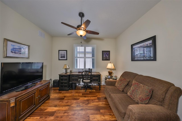 living room featuring ceiling fan, dark wood finished floors, and visible vents