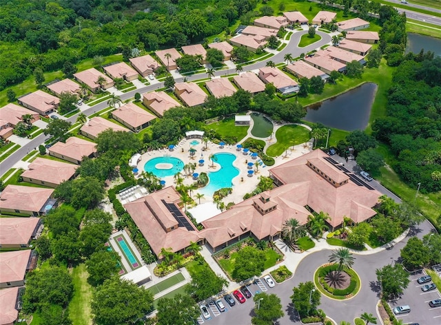 bird's eye view featuring a water view and a residential view