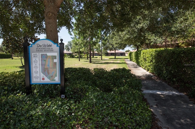 view of home's community with a lawn