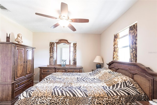 bedroom featuring ceiling fan and visible vents