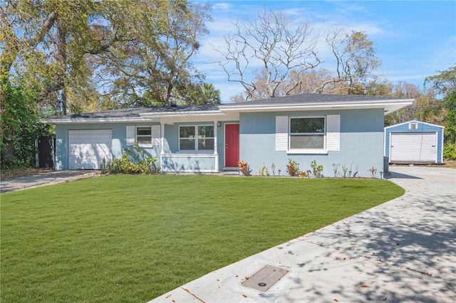 single story home with driveway, a garage, a front yard, and stucco siding