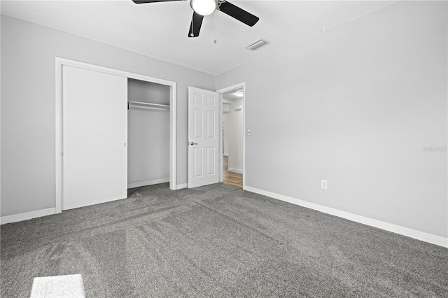 unfurnished bedroom with baseboards, visible vents, ceiling fan, carpet flooring, and a closet