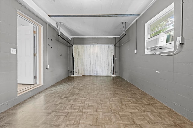 garage featuring concrete block wall