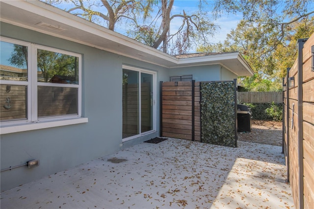 view of patio / terrace featuring fence