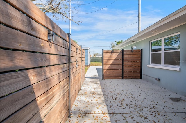 exterior space with fence and a patio