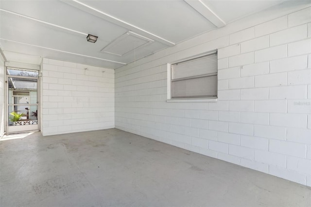 interior space with concrete block wall