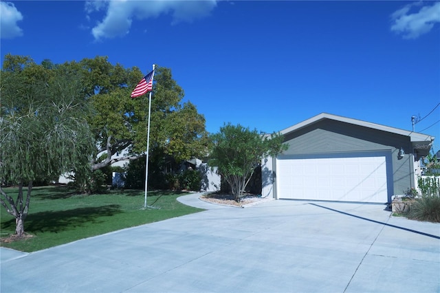 exterior space with a lawn and driveway