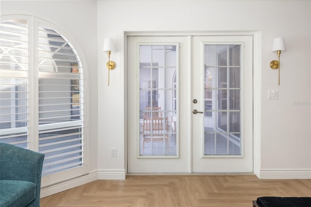 entryway featuring french doors and baseboards