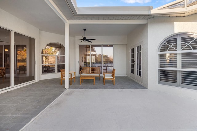 view of patio featuring a ceiling fan and french doors