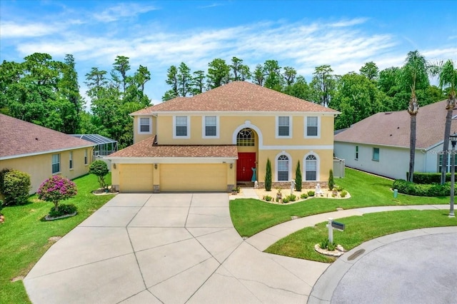 view of front of property featuring an attached garage, a front lawn, concrete driveway, and stucco siding