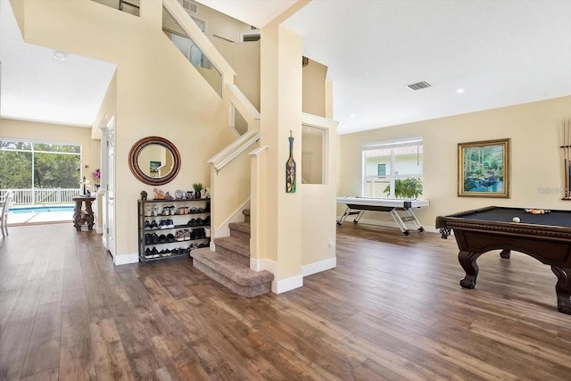 playroom with baseboards, visible vents, and dark wood-style flooring