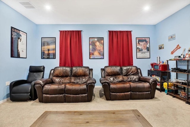 carpeted home theater featuring visible vents