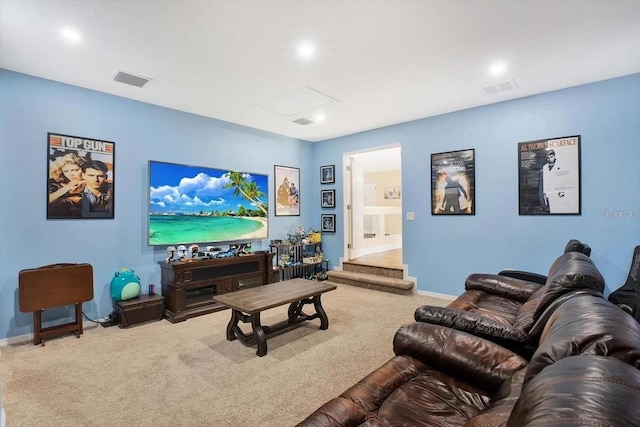 carpeted living room featuring visible vents and baseboards